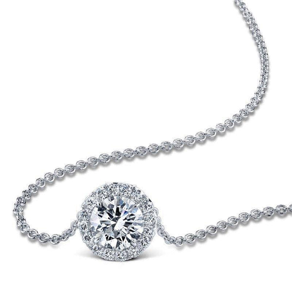 Hand crafted necklace featuring a 1.50 ct. round brilliant cut diamond center surrounded by .28 carats total weight in accent diamonds set in platinum.