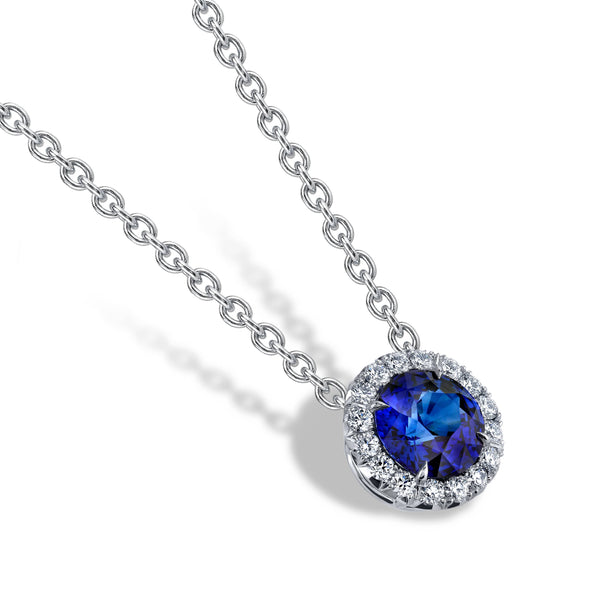 Custom made necklace featuring a 3.54 carat round vivid blue sapphire with .43 carats total weight in accent diamonds set in platinum on an 18