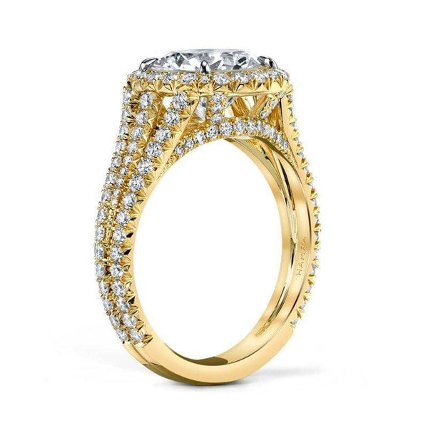 Custom made ring featuring a 2.65 carat round brilliant cut diamond center with 1.00 carats total weight in round brilliant cut accent diamonds set in 18k yellow gold.