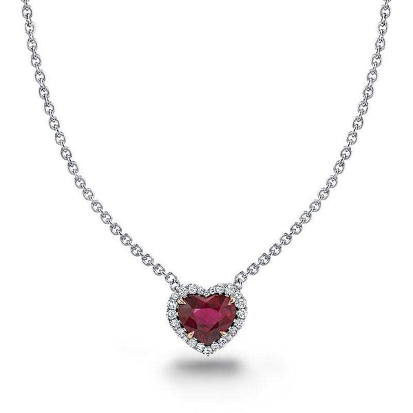 Custom made necklace featuring a 1.28 carat heart shaped ruby center with .11 carats total weight in round brilliant cut accent diamonds set in platinum with a 1.5mm round cable chain.