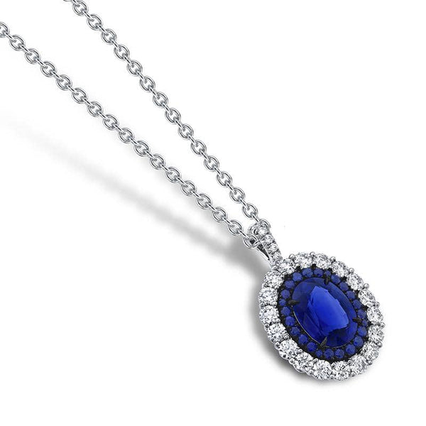 Custom hand fabricated necklace featuring a 2.87 carat oval sapphire center stone with .29 carats total weight in accent sapphires and 1.04 carats total in round brilliant cut accent diamonds set in platinum with an adjustable 16-18