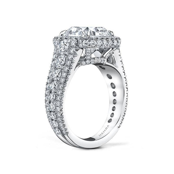 Handcrafted custom ring featuring a 5.00 carat cushion cut diamond center with 2.21 carats total weight in round brilliant cut diamonds set in platinum.g
