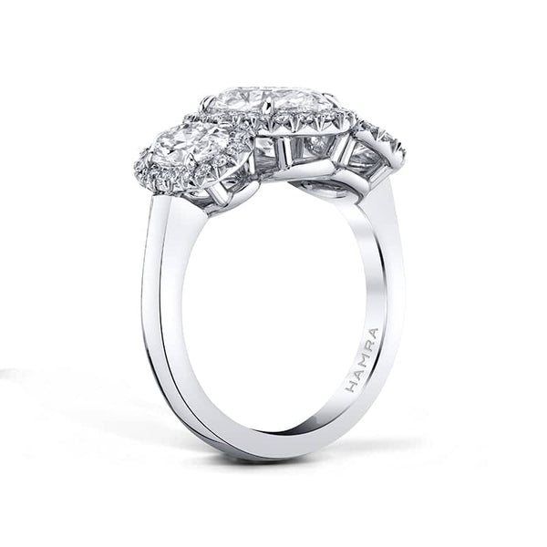 Custom made ring featuring a 2.01 carat oval shaped center diamond, 1.09 carats total weight in side oval diamonds and .39 carats total weight in round brilliant cut diamonds set in platinum.