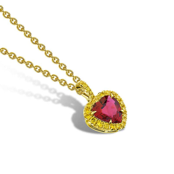 Hand fabricated necklace that features a 1.12 carat heart shaped ruby with .22 carats total weight in fancy yellow round diamonds set in 18k yellow gold with an adjustable 18k, 16 - 18