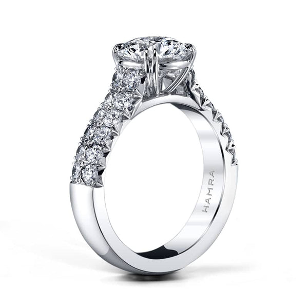 Custom handcrafted ring featuring a 2.01 carat round brilliant cut diamond center with .93 carats total weight in round brilliant cut accent diamonds set in platinum.