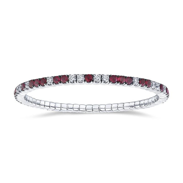 Custom made eternity bracelet featuring 4.44 carats total weight in rubies and 2.26 carats total in round brilliant cut diamonds set in 18k white gold.