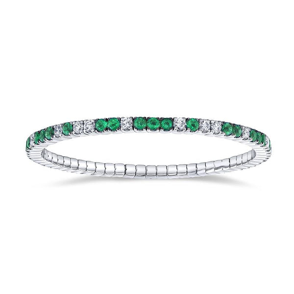Custom made eternity bracelet featuring 3.48 carats total weight in emeralds and 2.22 carats total weight in round brilliant cut diamonds set in 18k white gold.