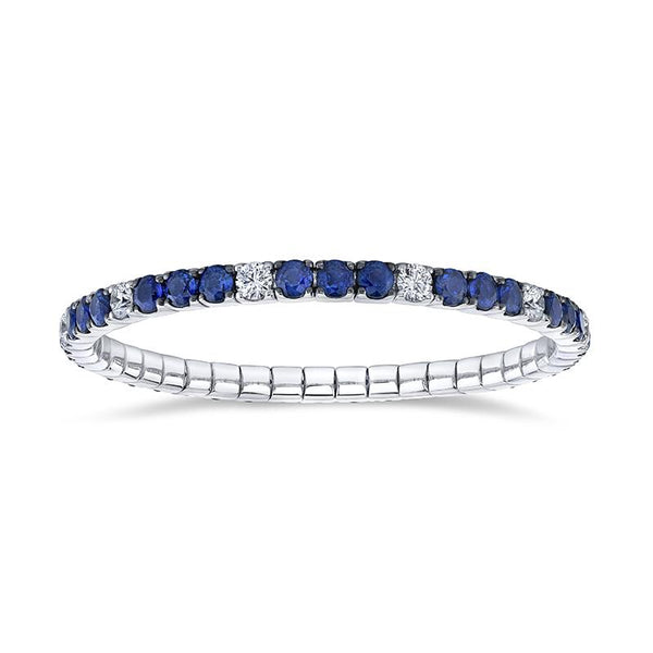 Custom made eternity bracelet featuring 10.90 carats total weight in sapphires and 2.83 carats total in round brilliant cut diamonds set in 18k white gold.