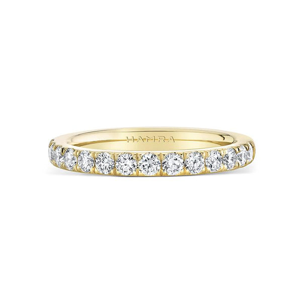 Custom made band featuring .58 carats total weight in round brilliant cut diamonds set in 18k yellow gold.
