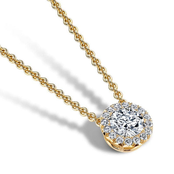 Hand crafted necklace featuring a 1.00 carat round brilliant cut center diamond with .23 carats total weight in round brilliant accent diamonds set in 18k yellow gold.