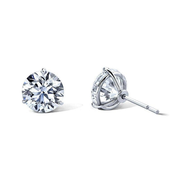 Diamond stud earrings featuring 6.00 carats total weight in round brilliant cut diamonds set in platinum.