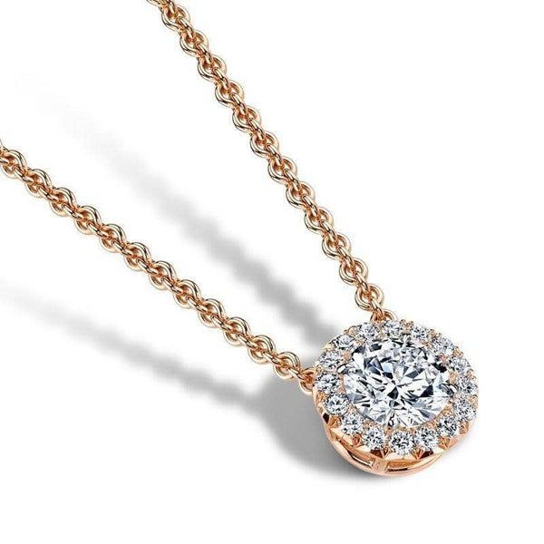 Hand crafted necklace featuring a 1.01 carat round brilliant cut center diamond with .23 carats total weight in accent diamonds set in 18k rose gold.