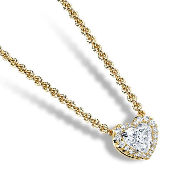 Custom made necklace featuring a 1.01 carat heart shaped diamond center with .11 carats total weight in round brilliant cut diamond accents set in 18k yellow gold with a 1.8mm round cable chain with lobster clasp.