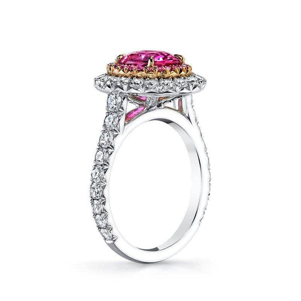 ring featuring a 2.93 ct.oval pink sapphire with 1.41 carats total weight in accent diamonds and .21 carats total in accent pink sapphires set in platinum and 18k rose gold.