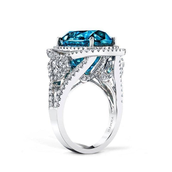  cocktail ring featuring a vivid 18.77 ct. blue zircon center stone surrounded by 1.53 carats in accent diamonds set in 18k white gold.