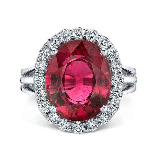 Custom made ring featuring a 10.76 carat rubellite center surrounded by .99 carats total weight in accent diamonds set in 18k white gold.