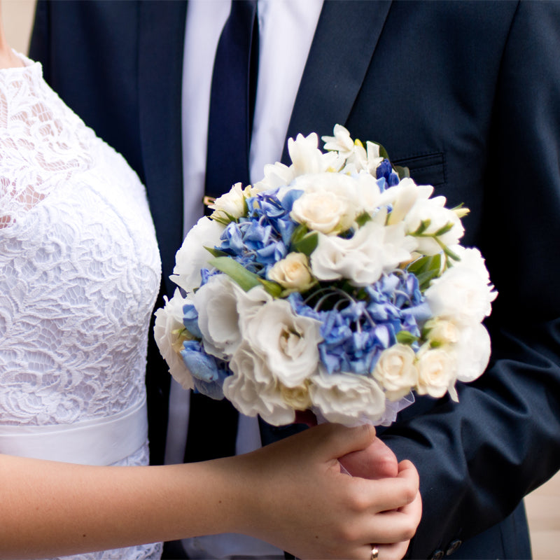 Married Couple with Bouquet of Flowers