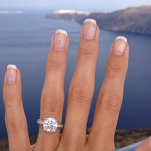 womans hand with engagement ring 