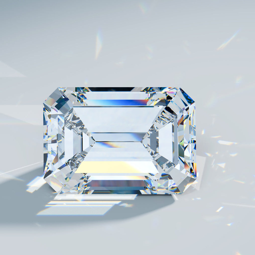 Picture of an emerald cut diamond on a grey background