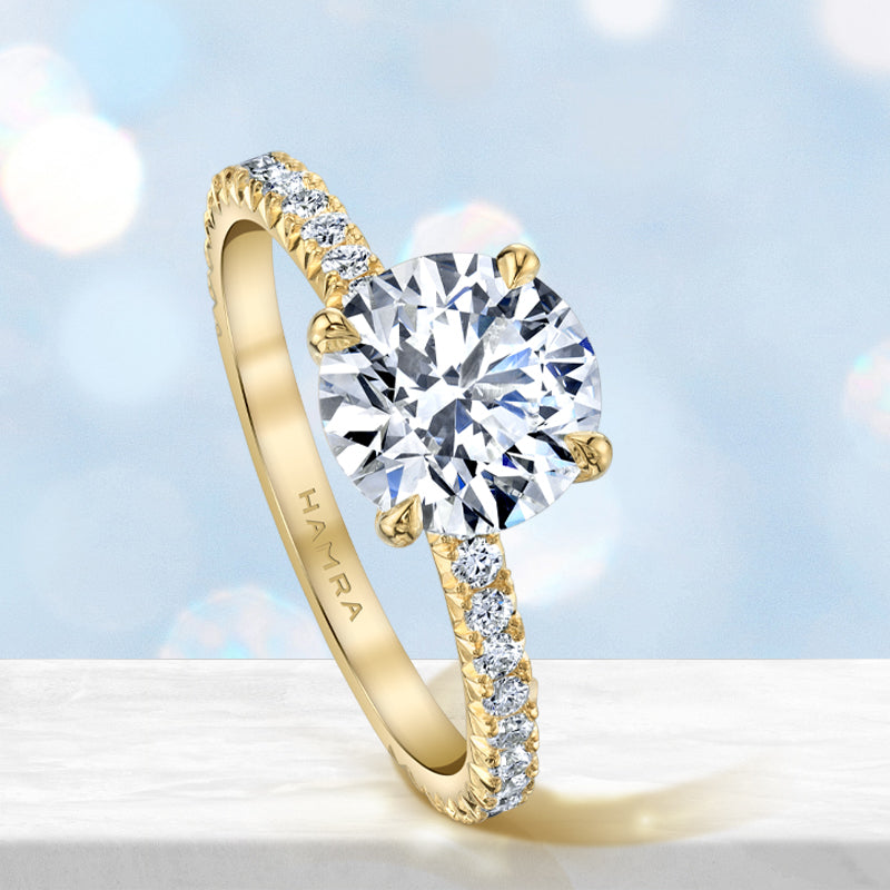 Diamond solitaire engagement ring in yellow gold