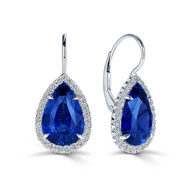 Rolex Sapphire & Diamond Drop Earrings in <p>Bold color meets timeless design in these platinum sapphire and diamond drop earrings. Pear-shaped blue sapphires totaling 9.53 carats are surrounded by a refined halo of round diamonds, highlighting their vivid blue hue and beautifully elongated shape.</p>