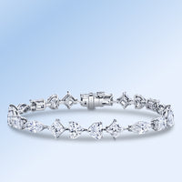 Multi shaped diamond bracelet in platinum.