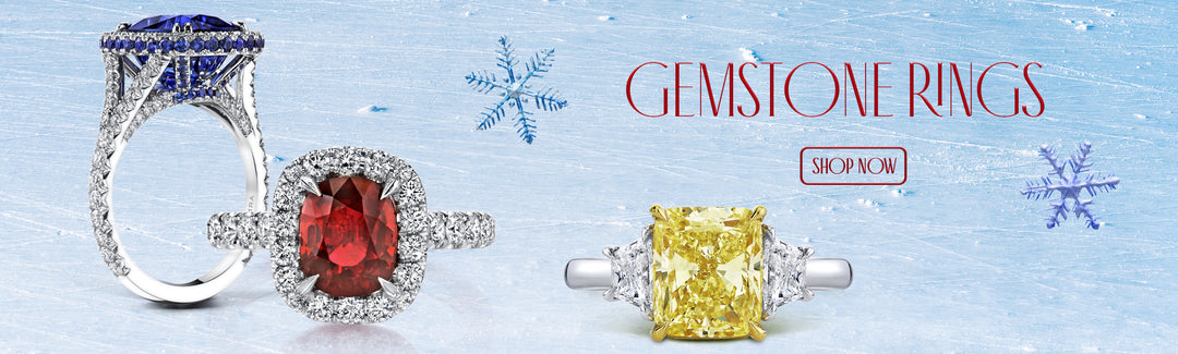 Gemstone rings at Hamra Jewelers. Sapphire, yellow diamond and ruby gemstone rings on a Holiday background.