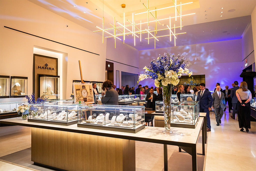 Liquor bottles on a glass bar in an intimate setting