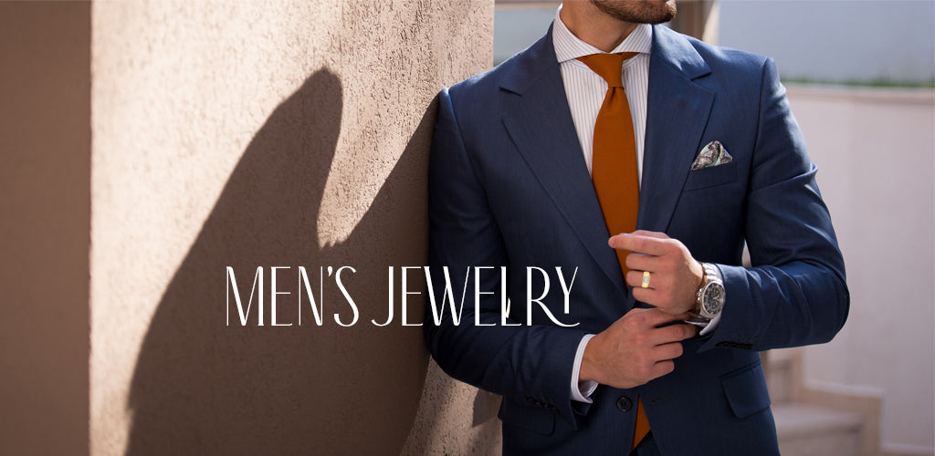 Man wearing a yellow gold ring leaning on a wall in a suit
