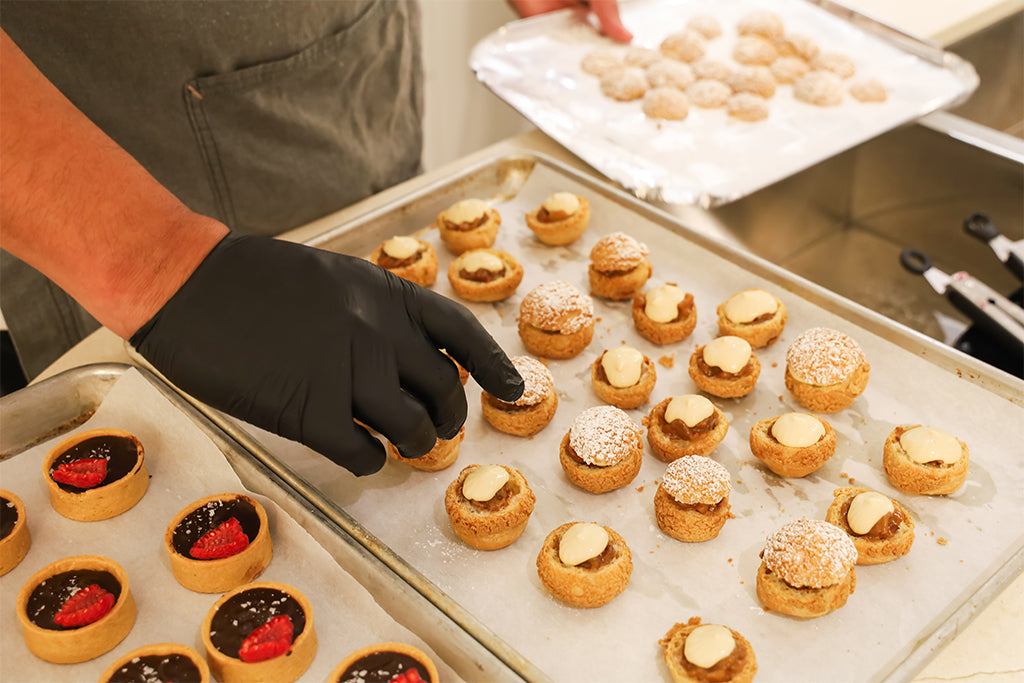 Hors douvres and a person selecting some.