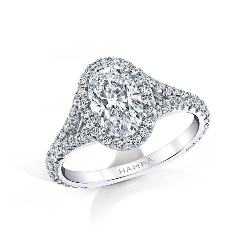 Custom made ring featuring a 1.50 carat oval shaped diamond center stone with .69 carats total weight in round brilliant cut accent diamonds set in platinum.