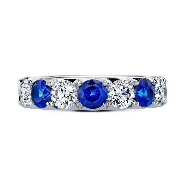 Custom made band featuring 1.18 carats total weight in round sapphires and 1.35 carats total weight in round brilliant cut diamonds set in platinum.