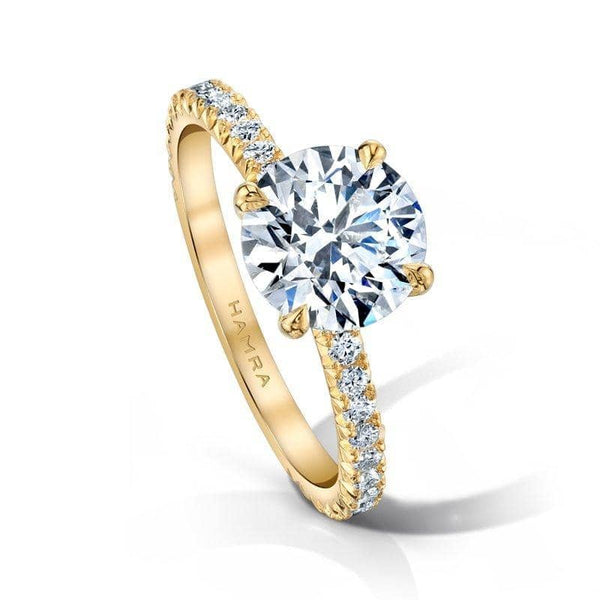 Custom made ring featuring a 2.00 round brilliant cut center diamond with .43 carats total weight in round brilliant cut accent diamonds set in 18k yellow gold.