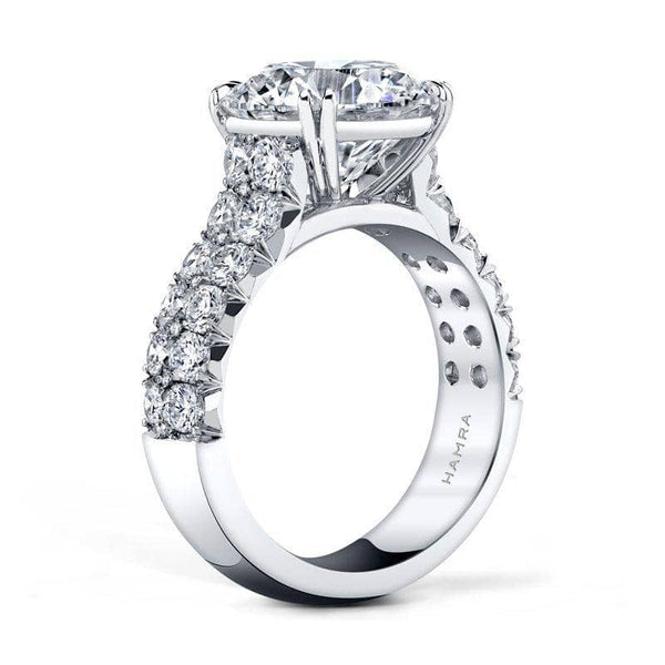 Hand fabricated ring featuring a 5.00 carat round brilliant cut center diamond with 1.61 carats total weight in round brilliant accent diamonds set in platinum.