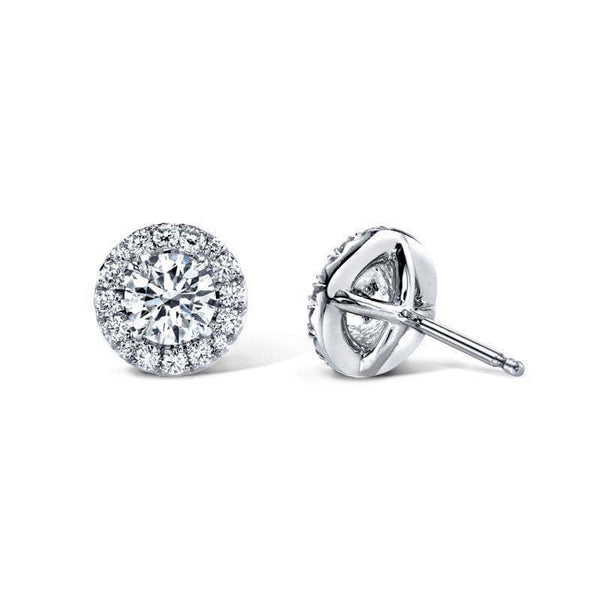 Custom made earrings featuring .64 carats total weight in round brilliant cut diamonds with .19 carats total in accent diamonds set in 18k white gold.