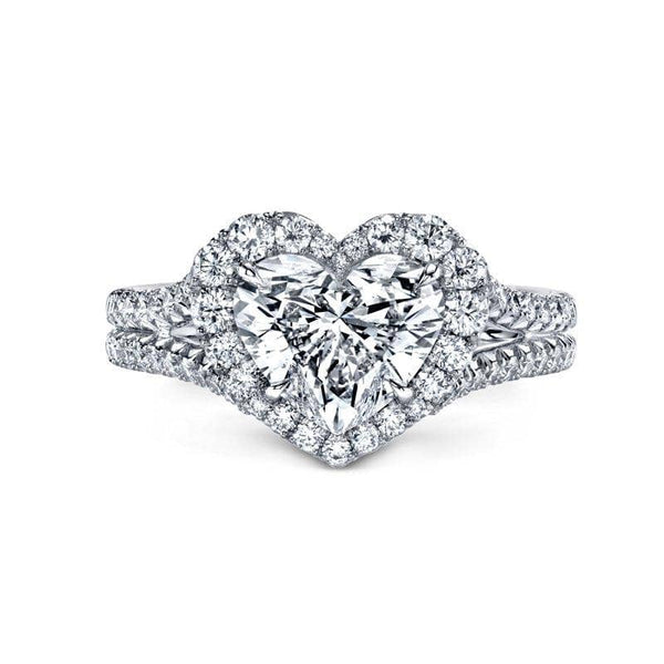 Custom made ring featuring a 2.00 ct. heart shaped diamond with .66 carats total weight in round brilliant cut accent diamonds set in platinum.