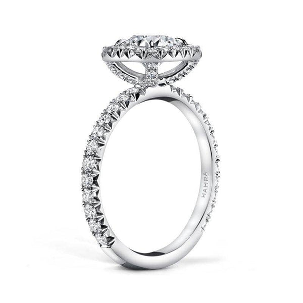 Handcrafted, custom made ring featuring a 1.17 carat round brilliant cut diamond center with .74 carats total weight in round brilliant cut accent diamonds set in a cushion cut halo in platinum.