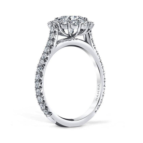 Hand crafted ring featuring a 1.64 carat round brilliant cut center diamond with 1.09 carats total weight in round brilliant cut accent diamonds set in platinum.