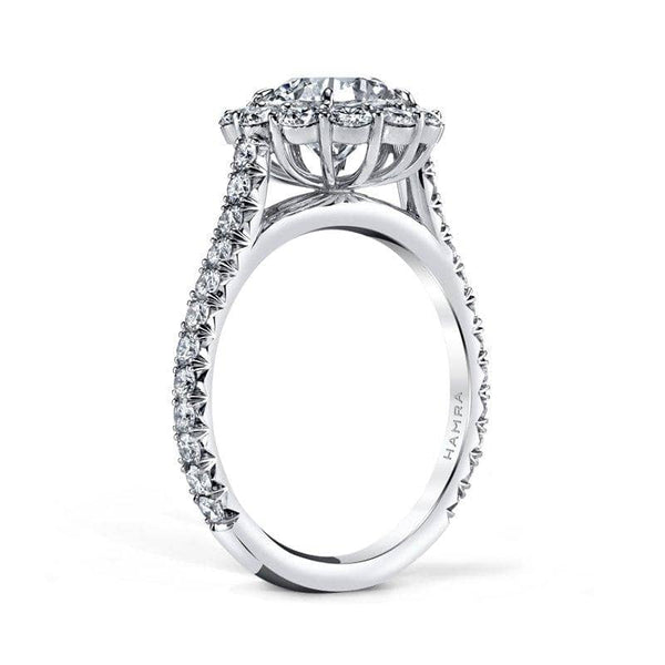 Hand crafted ring featuring a 1.13 carat round brilliant cut center diamond with 1.00 carats total weight in round brilliant cut accent diamonds set in platinum.
