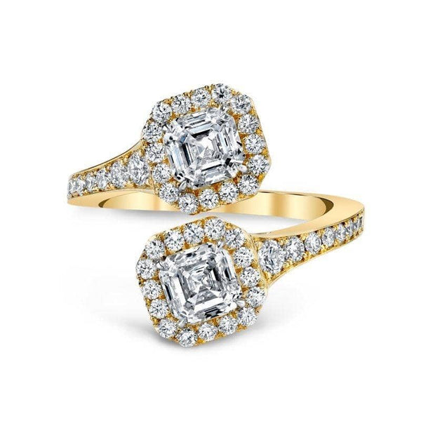 Custom made embrace ring featuring a .92 and a .91 carat asscher cut diamonds with .74 carats total weight in round brilliant cut accent diamonds set in 18k yellow gold.