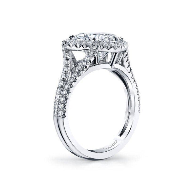 Custom made ring featuring a 3.53 carat heart shaped diamond with .67 carats total weight in round brilliant cut accent diamonds set in a split shank platinum ring.