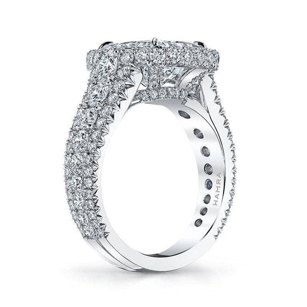 Custom made ring featuring a 3.50 carat radiant cut center diamond with 2.45 carats total weight in round brilliant cut diamond accents set in platinum.
