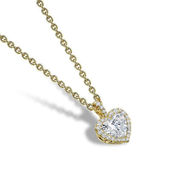 Custom made necklace featuring a .60 carat heart shaped center diamond with .10 carats total weight in round brilliant accent diamonds set in 18k yellow gold with a 1.6mm round cable chain with lobster clasp.