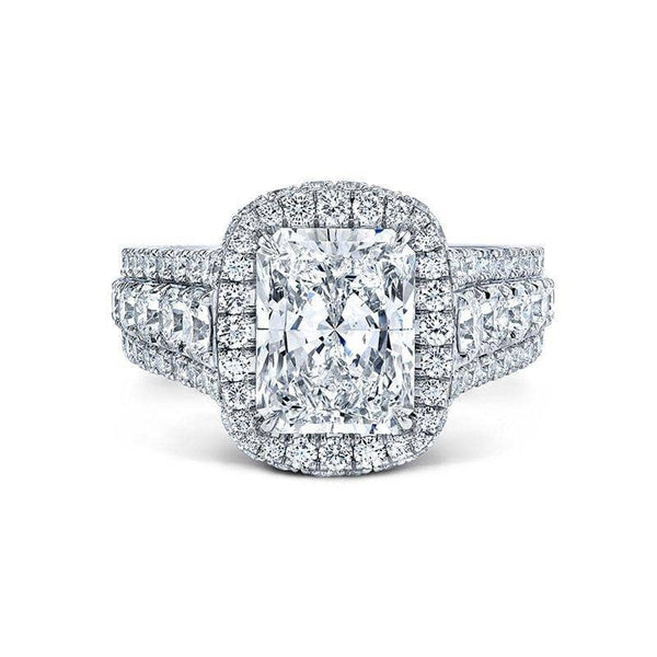 Custom made ring featuring a 3.02 carat radiant cut center diamond with 2.39 carats total weight in round brilliant cut accent diamonds set in platinum.