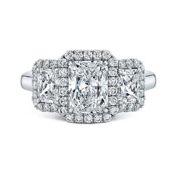 Custom fabricated ring featuring a 1.50 carat radiant cut center diamond, .86 carats total in radiant cut diamond sides stones and .40 carats total weight in round brilliant cut accent diamonds set in platinum.