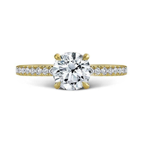Custom made ring featuring a 1.00 carat Forevermark round brilliant cut center diamond with .40 carats total weight in accent diamonds set in 18k yellow gold.