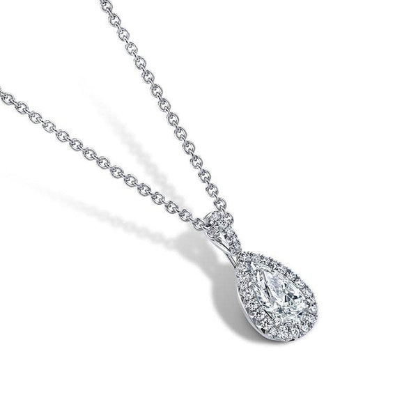 Custom made necklace featuring a 1.01 carat pear shaped center diamond with .17 carats total weight in accent diamonds set in platinum with a 16