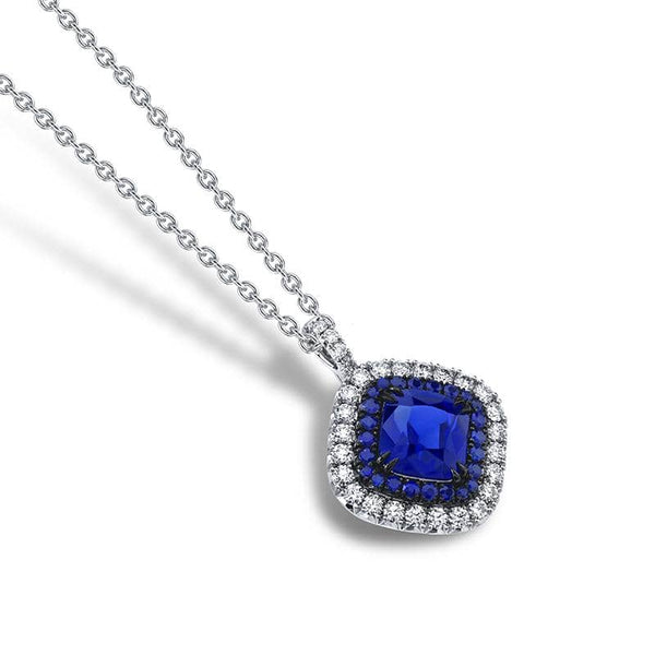 Hand crafted necklace featuring a 3.00 carat sapphire center surrounded by .26 carats total weight in accent round sapphires and .40 carats total weight in round brilliant cut diamonds set in platinum.