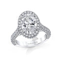 Custom made ring featuring a 3.51 carat oval brilliant center diamond with 1.84 carats total weight in round brilliant cut accent diamonds set in platinum.