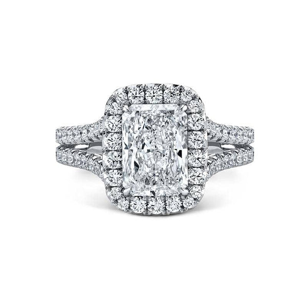Handcrafted custom ring featuring a 2.50 carat radiant cut diamond center with 1.20 carats total weight in round brilliant cut accent diamonds set in platinum.